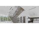 The modern staircase, with steel railings, connects the open floor plan. Lots of natural light at 4035 Bay Shore Rd, Sarasota, FL 34234
