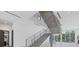 Modern home showcasing an open-concept staircase with steel railings and abundant natural light at 4035 Bay Shore Rd, Sarasota, FL 34234