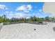 Expansive terrace with tile flooring, and glass railings, offering panoramic views at 4035 Bay Shore Rd, Sarasota, FL 34234
