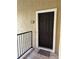 Condo entrance showing the front door with unit number 2024, complemented by a wooden porch at 4037 Crockers Lake Blvd # 24, Sarasota, FL 34238