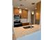 Bright kitchen with stainless steel appliances, stylish lighting, and stone countertops at 4037 Crockers Lake Blvd # 24, Sarasota, FL 34238