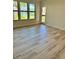 Bright living room with tile floors and large windows showcasing a serene view at 4037 Crockers Lake Blvd # 24, Sarasota, FL 34238