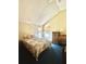 Bedroom offers a queen-size bed, window, and a small desk, and is decorated with plants at 4042 S Lockwood Ridge Rd, Sarasota, FL 34231