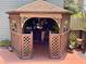 Charming backyard gazebo with seating area, creating a cozy outdoor space at 4042 S Lockwood Ridge Rd, Sarasota, FL 34231