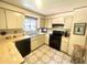 Functional kitchen features modern appliances, bright lighting, and efficient layout at 4042 S Lockwood Ridge Rd, Sarasota, FL 34231