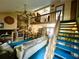 Cozy living room with a loft area, bright windows and comfortable seating at 4042 S Lockwood Ridge Rd, Sarasota, FL 34231