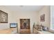 Bright bedroom featuring neutral tones, desk, decorative shelving, and bright window at 4121 Reflections Pkwy, Sarasota, FL 34233