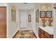 Inviting entryway with tile flooring, arched doorways, and a decorative rug at 4121 Reflections Pkwy, Sarasota, FL 34233