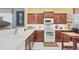 Well-equipped kitchen with white countertops, stainless steel appliances, and lots of cabinet space at 4121 Reflections Pkwy, Sarasota, FL 34233