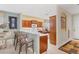 Kitchen with breakfast bar and view of stove, microwave, and dining area at 4121 Reflections Pkwy, Sarasota, FL 34233