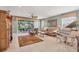 Comfortable living room with sliding glass doors, natural light, and stylish furnishings at 4121 Reflections Pkwy, Sarasota, FL 34233