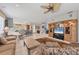 Open-concept living space with tile flooring, modern furnishings, and ample natural light at 4121 Reflections Pkwy, Sarasota, FL 34233