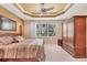 Spacious main bedroom with neutral tones, tray ceiling, and large window view at 4121 Reflections Pkwy, Sarasota, FL 34233