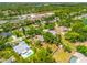 Aerial view of a home nestled among trees, highlighting the lot and surrounding neighborhood at 4253 Prairie View Dr, Sarasota, FL 34232