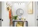 Bright bathroom featuring vanity with a round mirror, decorative accessories, and vibrant artwork at 4253 Prairie View Dr, Sarasota, FL 34232