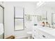 Clean and bright bathroom with a white vanity, window, and modern fixtures and neutral decor at 4253 Prairie View Dr, Sarasota, FL 34232