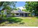 Back exterior of a home featuring a screen patio at 4253 Prairie View Dr, Sarasota, FL 34232