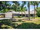 Charming single-story home featuring lush landscaping, a two-car garage, and a welcoming front entrance at 4253 Prairie View Dr, Sarasota, FL 34232