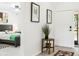 Hallway leading into a bedroom with neutral tones, stylish decor, and patterned rugs at 4253 Prairie View Dr, Sarasota, FL 34232