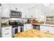 Modern kitchen equipped with stainless steel appliances, granite countertops, and ample cabinetry at 4253 Prairie View Dr, Sarasota, FL 34232