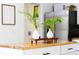 Kitchen island with butcher block top and plants on top at 4253 Prairie View Dr, Sarasota, FL 34232