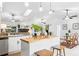 Bright modern kitchen with granite countertops, stainless appliances, and an island cooktop at 4253 Prairie View Dr, Sarasota, FL 34232