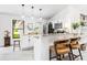 Open kitchen with a breakfast bar, pendant lighting, stainless steel appliances and white cabinets at 4253 Prairie View Dr, Sarasota, FL 34232