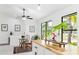 Bright modern kitchen showcasing a casual dining area and natural light from large windows at 4253 Prairie View Dr, Sarasota, FL 34232