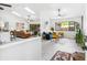 Open living room features high ceilings, skylights, and access to outdoor spaces at 4253 Prairie View Dr, Sarasota, FL 34232
