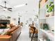 Inviting living room with a fireplace, ceiling fans, and stylish furnishings at 4253 Prairie View Dr, Sarasota, FL 34232