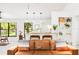Bright open concept living room with a modern interior, breakfast bar, and scenic view at 4253 Prairie View Dr, Sarasota, FL 34232