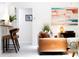 Cozy seating area with a tan leather couch complemented by colorful modern artwork at 4253 Prairie View Dr, Sarasota, FL 34232