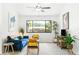 Cozy living room features a comfortable blue velvet sofa and serene decor at 4253 Prairie View Dr, Sarasota, FL 34232