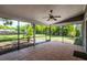 Enclosed patio featuring tile flooring and views of the spacious backyard at 4253 Prairie View Dr, Sarasota, FL 34232