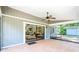 Covered patio featuring tiled floor and ceiling fan, with a view to the backyard at 4253 Prairie View Dr, Sarasota, FL 34232