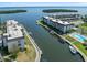 Aerial view showing docks, a pool and tennis courts at the condominium complex at 4310 Falmouth Dr # 307, Longboat Key, FL 34228
