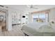 Comfortable bedroom features serene water views, neutral decor, wood floors, and mirrored closet doors at 4310 Falmouth Dr # 307, Longboat Key, FL 34228