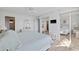 Neutral bedroom features mirrored closet doors, water view and furnishings at 4310 Falmouth Dr # 307, Longboat Key, FL 34228