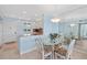 Open dining area featuring glass table, seating for four, natural light, and lovely views at 4310 Falmouth Dr # 307, Longboat Key, FL 34228