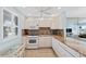 A well-lit kitchen features granite countertops, white cabinets, and modern appliances, perfect for culinary enthusiasts at 4310 Falmouth Dr # 307, Longboat Key, FL 34228