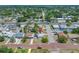 An aerial view of the home's neighborhood with a nearby road and tree coverage at 440 42Nd N St, St Petersburg, FL 33713
