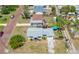 Aerial view of property in residential neighborhood with tree coverage, parking, and corner lot location at 440 42Nd N St, St Petersburg, FL 33713