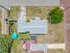 Aerial view showcasing a cozy home with a nice backyard, patio, and mature landscaping at 440 42Nd N St, St Petersburg, FL 33713