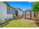Backyard with a storage shed, and lush lawn at 440 42Nd N St, St Petersburg, FL 33713