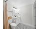 Bathroom featuring patterned tile floors, a vanity with sink, toilet, and shower with light and bright feel at 440 42Nd N St, St Petersburg, FL 33713