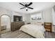 Neutral bedroom featuring a bed, dresser, TV, and large windows at 440 42Nd N St, St Petersburg, FL 33713