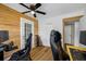 Bedroom featuring hardwood flooring, ceiling fan, and accent wall at 440 42Nd N St, St Petersburg, FL 33713