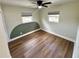 Bright bedroom with modern flooring, ceiling fan, and two windows at 440 42Nd N St, St Petersburg, FL 33713