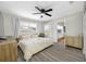 Bright bedroom featuring a bed, dresser, TV, and large windows at 440 42Nd N St, St Petersburg, FL 33713