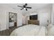 Bright bedroom featuring closet, dresser, TV, and large windows at 440 42Nd N St, St Petersburg, FL 33713